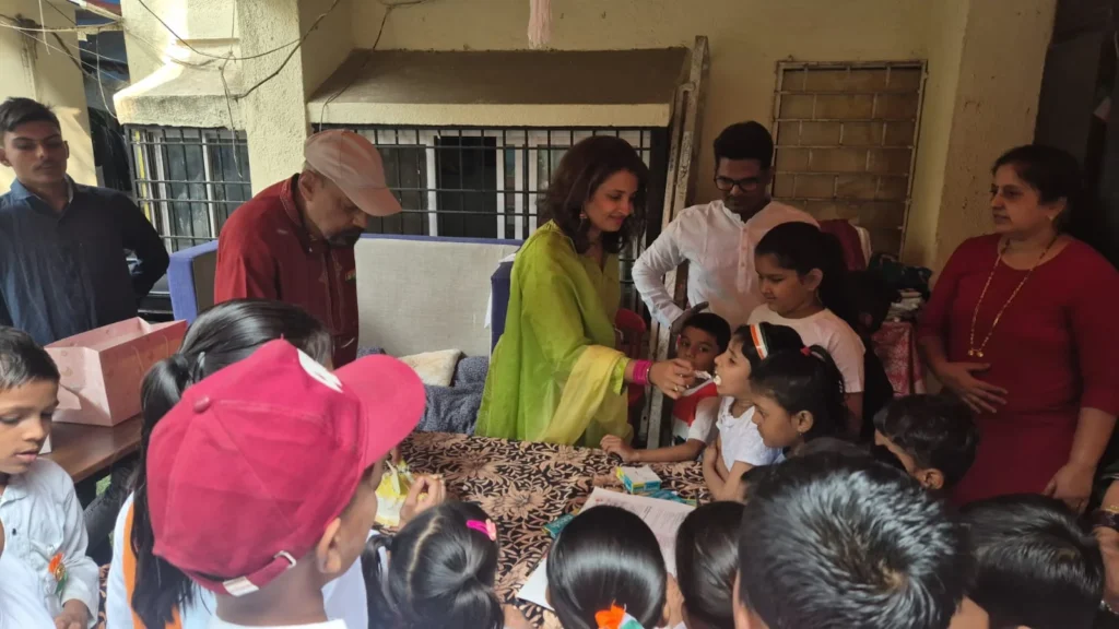 B-Sociall team celebrating with children at a CSR event