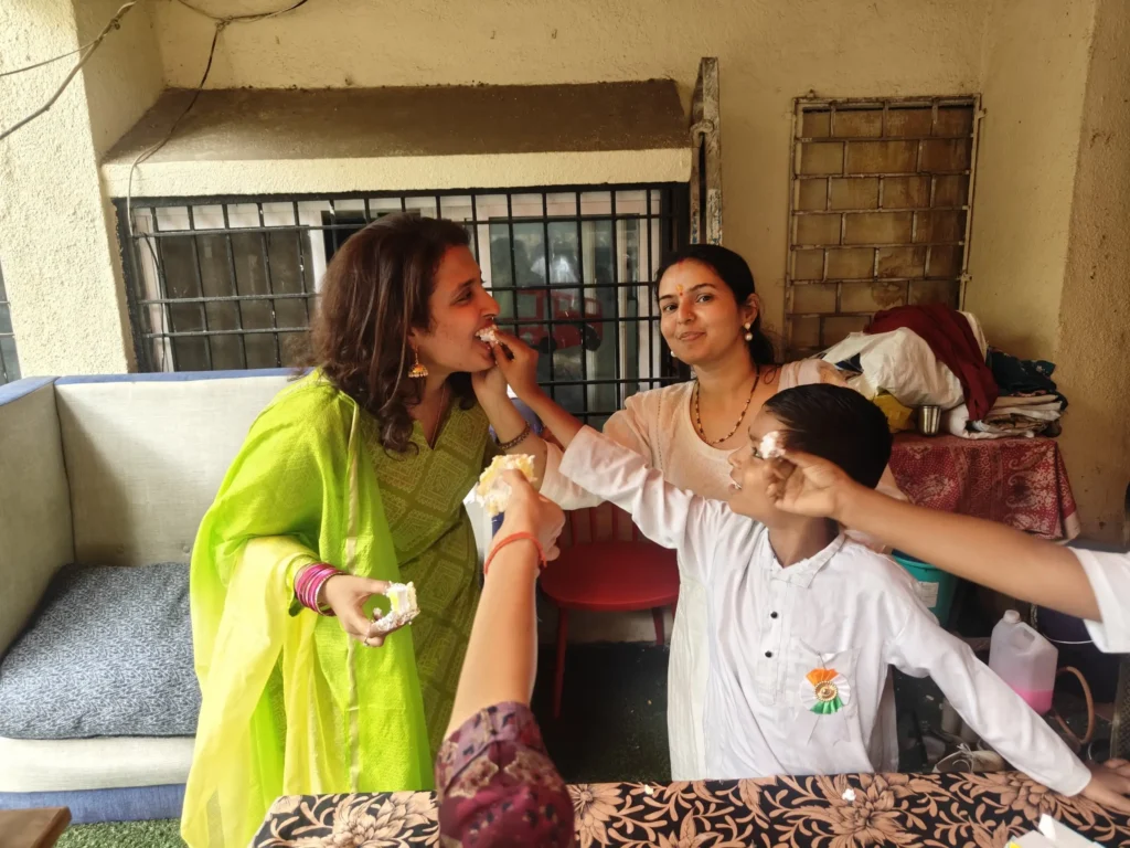 Sharing cake with children at a B-Sociall CSR event